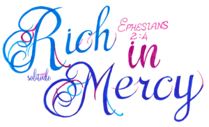 the words "Rich in Mercy" written in light blue and dark blue with pink accents