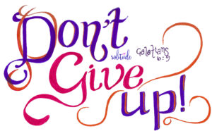 the words, "Don't Give Up" written in purple and pink
